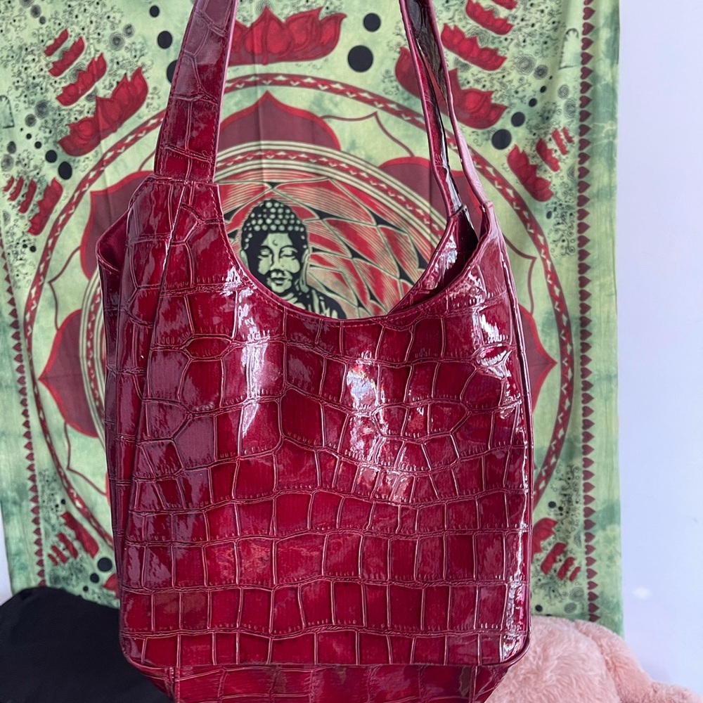 Maroon snake-skin bag